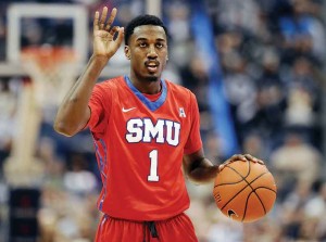 SMU’s Ryan Manuel gestures during the second half of an NCAA college basketball game against Connecticut, in Hartford, Conn. Ryan and Simone Manuel were always close. They still talk just about every day, even though they attend college in different parts of the country. 