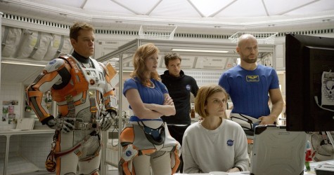 In this photo provided by Twentieth Century Fox, Matt Damon, from left, as Astronaut Mark Watney, Jessica Chastain as Melissa Lewis, Sebastian Stan as Chris Beck, Kate Mara as Beth Johanssen, and Aksel Hennie as Alex Vogel, appear in a scene in the film, "The Martian." The movie releases in U.S. theaters on Oct. 2, 2015. 