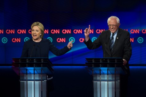 Democratic presidential candidates Hillary Clinton, left, and, Sen. Bernie Sanders, I-Vt., argue a point during a Democratic presidential primary debate at the University of Michigan-Flint, Sunday, March 6, 2016, in Flint, Mich. 
