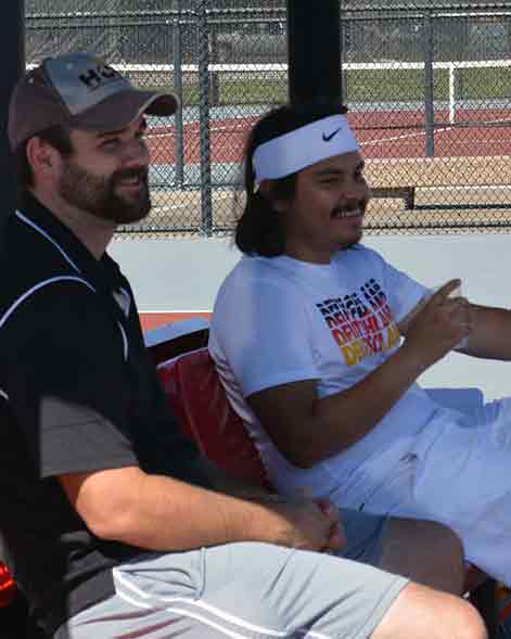 Coach Abernathy and Daniel Campos enjoy the beautiful weather and cheering on the team.