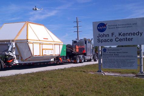 In this Thursday photo provided by NASA, The Orion spacecraft, in a protective covering, is returned to the agency’s Kennedy Space Center in Cape Canaveral, Fla. It rocketed into orbit Dec. 5, traveling 3,600 miles into space on an unmanned test flight that proved to be a great success. NASA plans to use future models to help get astronauts to Mars in coming decades. 