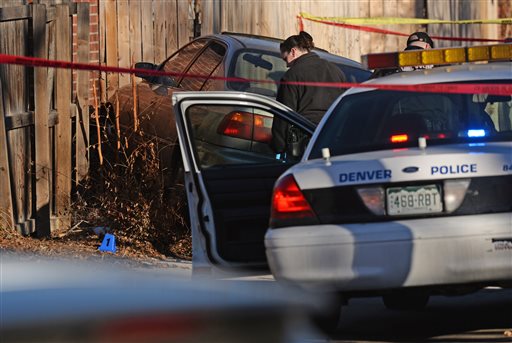 Denver police shot and killed a female suspect early Monday, Jan. 26, 2015, after they said she drove a stolen car at officers, hitting one of them in the leg. Neighbors described the driver as a teenager.