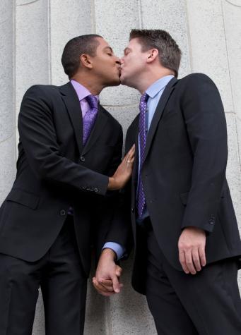 Todd, left, and Jeff Delmay kiss on the courthouse steps after having attended a hearing in which a Miami-Dade Circuit Judge cleared the way for a gay and lesbian couples to marry,  Jan. 5, 2015, in Miami. 