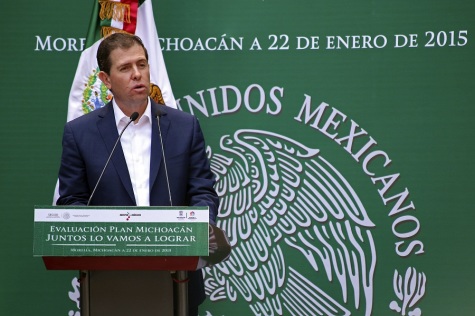 Alfredo Castillo, federal security commissioner for the state of Michoacan, gives his departure speech in Morelia, Mexico, Thursday, Jan. 22, 2015. Appointed a little over a year ago to rein in and regularize vigilante groups as rural police, Castillo will be replaced by an army general who will play a more limited role leading federal security forces in Michoacan, a largely agricultural state known for its limes and avocados but also social unrest and drug gang violence.