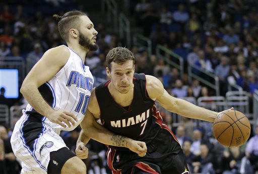 Miami Heat's Goran Dragic drives around Orlando Magic's Evan Fournier, left, during the first half of an NBA basketball game, Wednesday, Feb. 25, 2015, in Orlando, Fla. The Phoenix Suns trade Goran Dragic to the Miami Heat for Danny Granger, Norris Cole, Shawne Williams and Justin Hamilton and two first round picks. This is only one of several NBA deadline deals. 