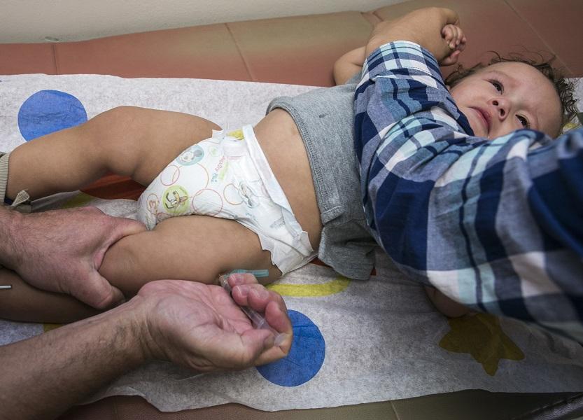 In this Jan. 29 photo, pediatrician Charles Goodman vaccinates 1-year-old Cameron Fierro with the measles-mumps-rubella vaccine, or MMR vaccine, at his practice in Northridge, Calif. The largest measles outbreak in recent memory occurred in Ohios Amish country where 383 people were sickened last year after several traveled to the Philippines and brought the virus home. While that outbreak got the publics attention, its nowhere near the level as the latest measles outbreak that originated at Disneyland in December, prompting politicians to weigh in and parents to voice their vaccinations views on Internet message boards. 