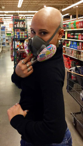 Brian wearing her respiratory mask while shopping.