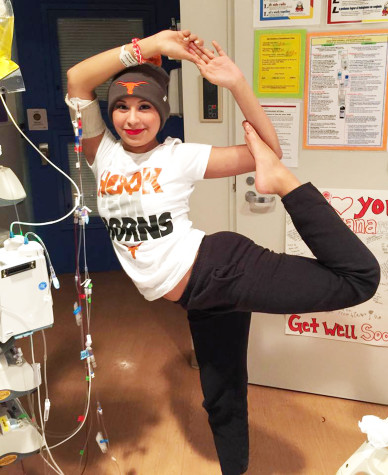 Briana doing a yoga pose while hooked up with "Robi."