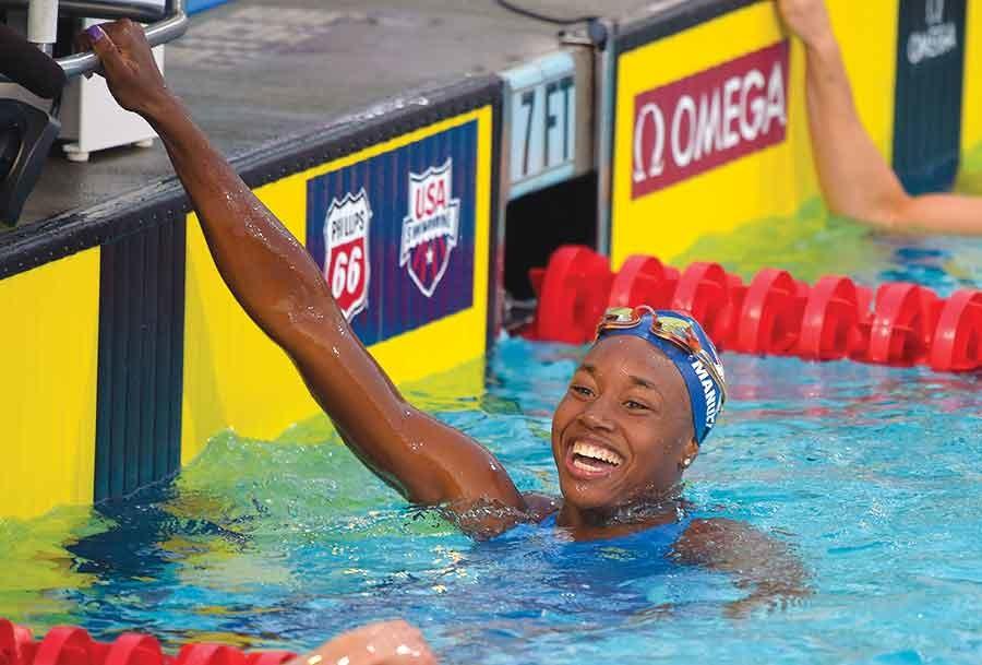Simone Manuel smiles after winning the womens 50-meter freestyle final at the U.S. nationals of swimming in Irvine, Calif. Ryan and Simone Manuel were always close. They still talk just about every day, even though they attend college in different parts of the country. 
