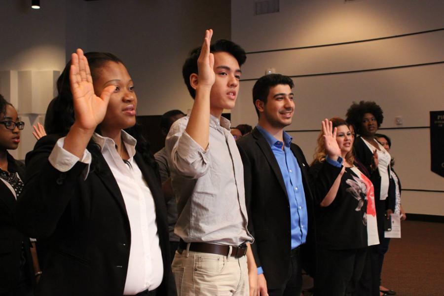 Here, some of Omega Sigma newest members take their membership pledge at the honor society's induction ceremony on Friday April 10.

Omega Sigma is HCC's chapter of Phi Theta Kappa.