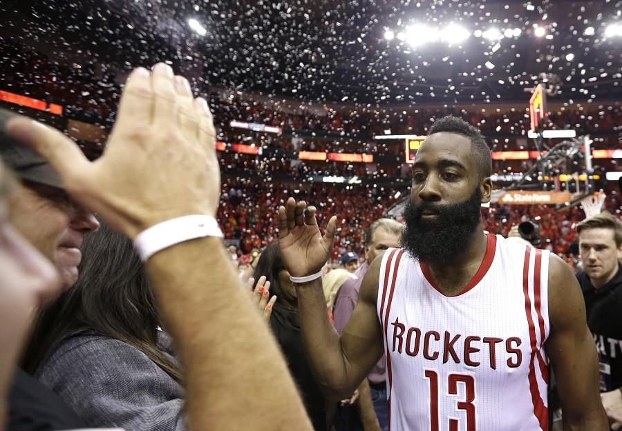 Houston Rockets' James Harden (13) celebrates after defeating the Los Angeles Clippers 113-100 in Game 7 of the NBA basketball Western Conference semifinals, Sunday, May 17, 2015, in Houston. 