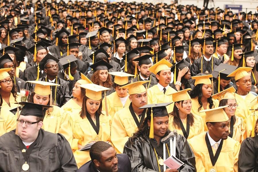 Students await their name being called during the 2011 graduation ceremony. This years graduation is schedule for Saturday, May 16 at NRG Stadium. 