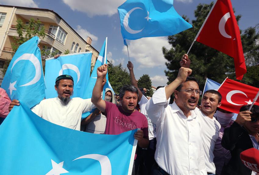 Uighurs+living+in+Turkey+and+Turkish+supporters%2C+some+carrying+flags+of+Turkey+and+East+Turkestan%2C+the+term+separatist+Uighurs+and+Turks+use+to+refer+to+the+Uighurs+homeland+in+Chinas+Xinjiang+region%2C+shout+slogan+to+denounce+Chinese+rule+before+the+riot+police+used+pepper+spray+to+push+back+a+group+of+Uighur+protesters+who+try+to+break+through+a+barricade+outside+the+Chinese+Embassy+in+Ankara%2C+Turkey%2C+Thursday%2C+June+9.+2015.+Thailand+sent+back+to+China+more+than+100+ethnic+Uighur+refugees+on+Thursday%2C+drawing+harsh+criticism+from+the+U.N.+refugee+agency+and+human+rights+groups+over+concerns+that+they+face+persecution+by+the+Chinese+government.+Protesters+in+Turkey%2C+which+accepted+an+earlier+batch+of+Uighur+refugees+from+Thailand%2C+ransacked+the+Thai+Consulate+in+Istanbul+overnight.