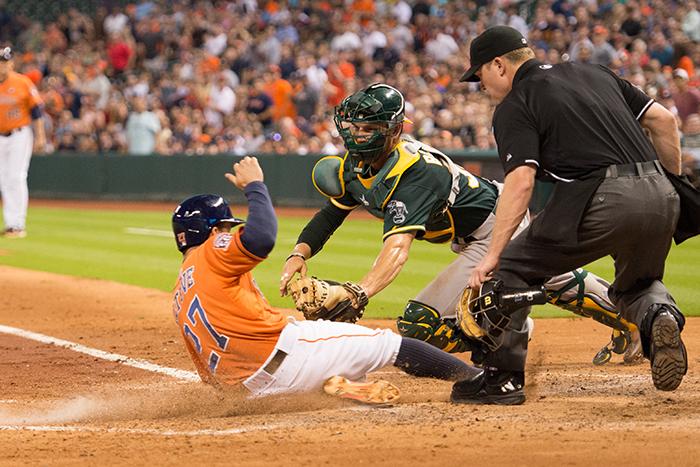 Jose Altuve beeting the throw home in the 3rd inning of game 1 of the series.