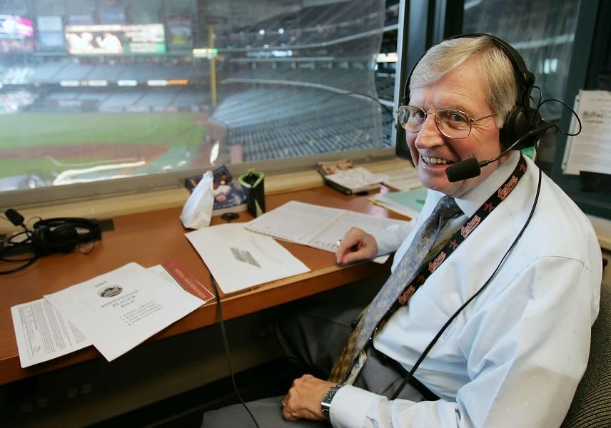 In this July 29, 2005, file photo, Hall of Fame broadcaster Milo Hamilton takes a break from his pre-game routine as he smiles in his radio booth before a baseball game in Houston. Hamilton, the longtime play-by-play radio voice of the Astros, died Thursday, Sept. 17, 2015, in Houston, the team said in a statement. He was 88. Hamilton spent 60 years broadcasting MLB games.