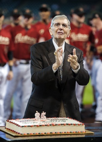 In this Sept. 2, 2012, photo, Houston Astros radio broadcaster Milo Hamilton reacts as fans sing to celebrate his 85th birthday before a baseball game against the Cincinnati Reds in Houston. Hamilton, the longtime play-by-play radio voice of the Astros and a Hall of Fame broadcaster, died Thursday, Sept. 17, 2015, in Houston, the team said in a statement. He was 88. Hamilton spent 60 years broadcasting MLB games.