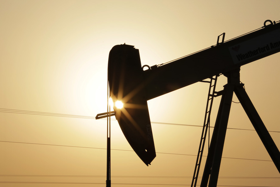 An oil pump works at sunset Wednesday, Sept. 30, 2015, in the desert oil fields of Sakhir, Bahrain.  Consumer prices across the 19-country eurozone fell in September for the first time in half a year as energy prices tanked, official figures showed Wednesday, in a development thats likely to ratchet up pressure on the European Central Bank to give the region more stimulus. The 0.1 percent annual decline reported by Eurostat, the EUs statistics office, was widely anticipated following the recent drop in global oil prices. (AP Photo/Hasan Jamali)