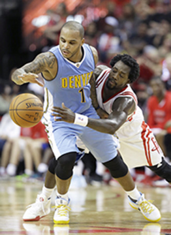 Houston Rockets' Patrick Beverley, right, tries to get the ball from Denver Nuggets' Jameer Nelson in the second half.