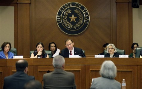 In this July 29, photo, Sen. Charles Schwertner, R-Georgetown, center, questions witnesses during a Texas Senate Health and Human Services Committee hearing on Planned Parenthood videos covertly recorded that target the abortion provider in Austin, Texas. Texas announced Monday, Oct. 19, that it was cutting off Medicaid funding to Planned Parenthood clinics following undercover videos of officials discussing fetal tissue, potentially triggering a legal fight like the one unfolding in neighboring Louisiana. 