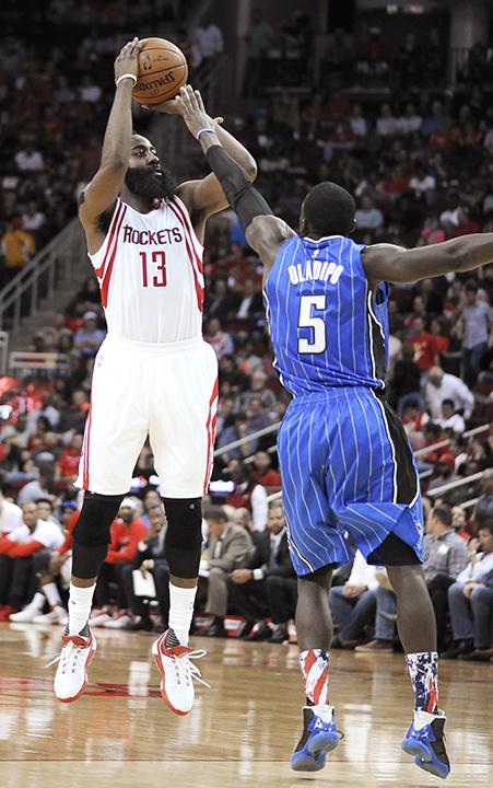 Houston Rockets James Harden (13) shoots over Orlando Magics Victor Oladipo (5) 