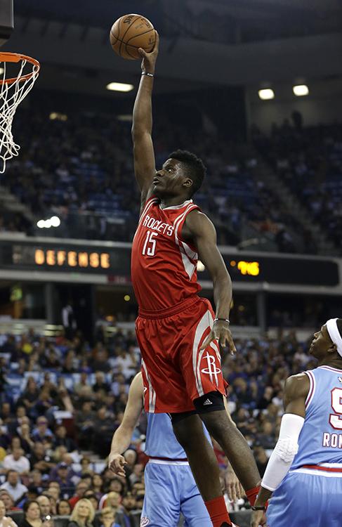 Houston Rockets center Clint Capela (15) goes up for a stuff as Sacramento Kings guard Rajon Rondo watches.