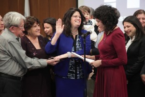 Surrounded by friends and family, Dr. Adriana Tamez takes the oath of office, marking the start of her second term as HCC District III Trustee, and Board Chair for 2016. Texas State Representative Carol Alvarado of district 145 administered the oath of office for Tamez.