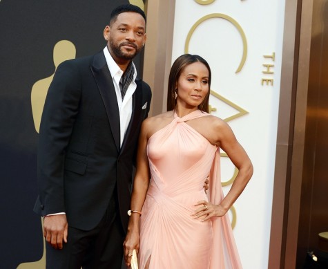 In this March 2, 2014, photo, Will Smith, left, and Jada Pinkett Smith arrive at the Oscars at the Dolby Theatre in Los Angeles. Smith said Thursday, Jan. 21, he will not attend the Academy Awards next month, joining his wife, Jada Pinkett Smith, and others in protest against two straight years of all-white acting nominees. (Photo by Jordan Strauss/Invision/AP, File)
