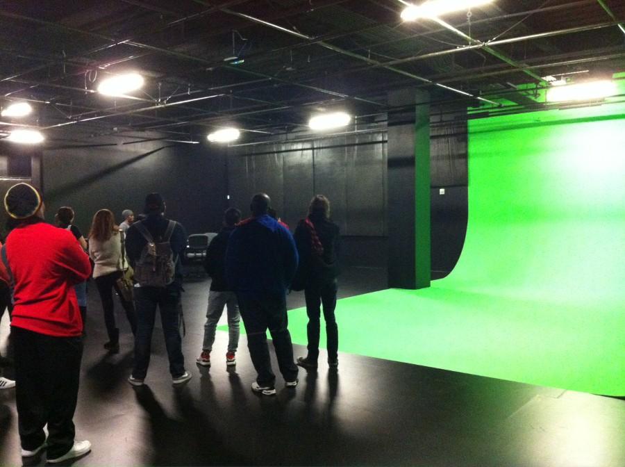 Students touring the sound stage with a green screen on the third floor of the Alief-Hays where the new Digital Arts and Media Technology center is located. 