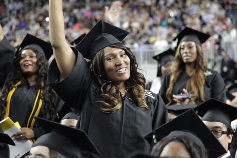 An HCC graduate in a moment of celebration during the commencement ceremony, May 2015. 