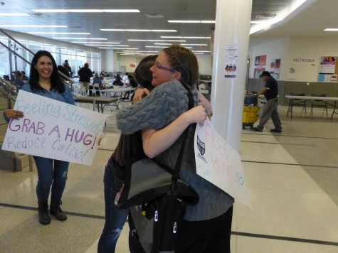 Students give free hugs