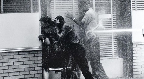 Chalmers and  two African-Americans being hosed in Birmingham, Alabama, in 1963. 