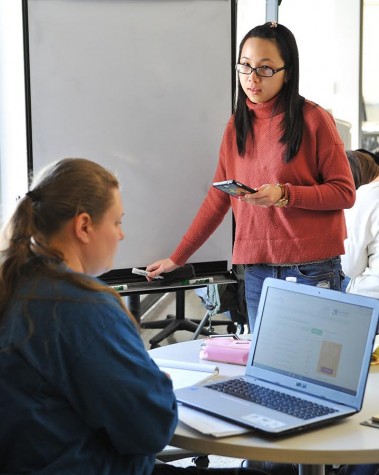 Ngo Tran (right) tutors a student inside the Learning Emporium at HCC Central on Feb. 8. Online tutoring is available 24 hours a day at hccs.askonline.net All HCC tutoring is free to HCC students.