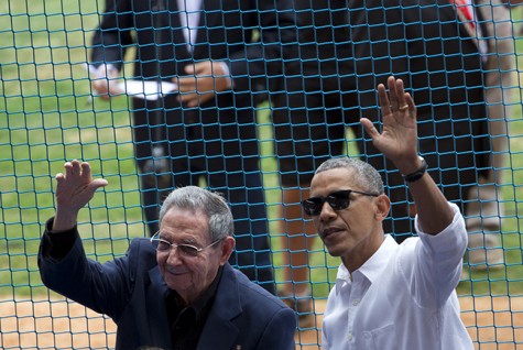 U.S. President Barack Obama, right, and his Cuban counterpart Raul Castro wave to cheering fans as they arrive for a baseball game between the Tampa Bay Rays and the Cuban national baseball team, in Havana, Cuba, Tuesday, March 22, 2016. The crowd roared as Obama and Cuban President Raul Castro entered the stadium and walked toward their seats in the VIP section behind home plate. It's the first game featuring an MLB team in Cuba since the Baltimore Orioles played in the country in 1999. 