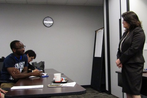 Board Chair Adriana Tamez speaking with HCC student Adrian Nwanze during the question and answer portion of the meeting at the United Student Council meeting March 11. 