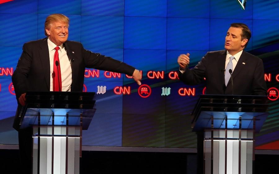 Republican presidential candidate Donald Trump, reacts as Republican presidential candidate Sen. Ted Cruz, R-Texas,rebukes a comment made by Trump during the Republican presidential debate sponsored by CNN, Salem Media Group and the Washington Times at the University of Miami,  Thursday, March 10, 2016, in Coral Gables, Fla. 