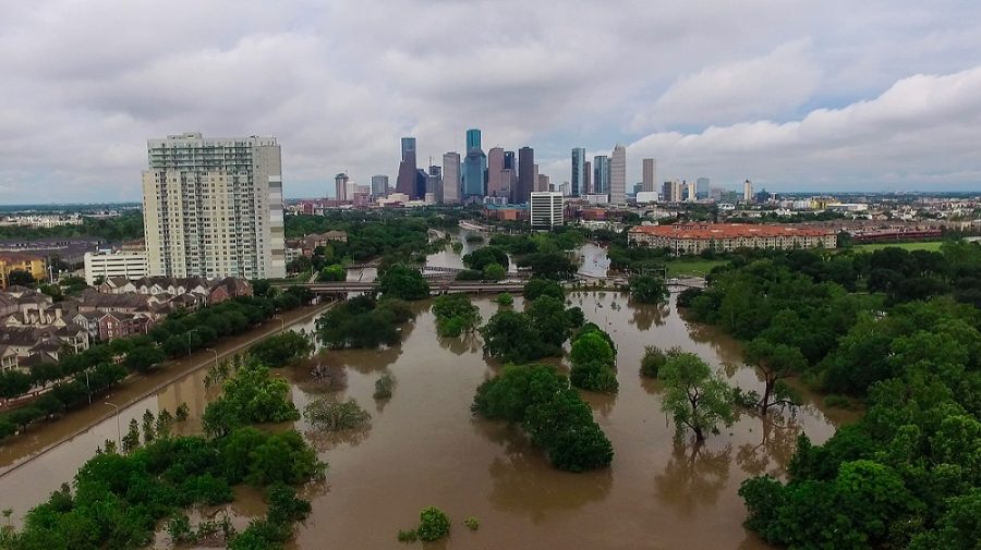 This drone image taken Monday shows Buffalo Bayou out of its banks covering Memorial Drive, left, and Allen Parkway, right, near downtown Houston at the Studemont Street/Montrose Boulevard bridge. As of Wednesday, officials said eight have died in the floods while approximately 1,200 have been rescued from flooded residences. 