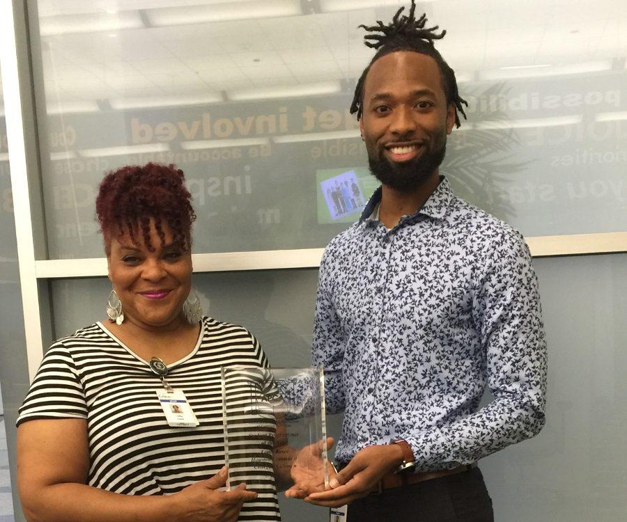 HCC student Lottie Kesee (left) poses with her Advisor Darnell Pledger (right) and her 2016 APCA award.