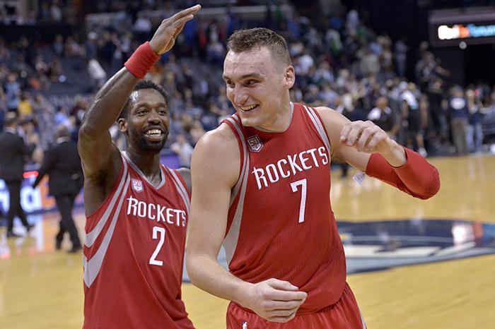 Houston Rockets guard Patrick Beverley (2) congratulates forward Sam Dekker (7) after Dekker scored 30 points.  (AP Photo/Brandon Dill)