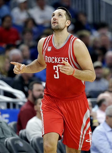 Houston Rockets Ryan Anderson reacts after sinking one of his five 3-point baskets against the Orlando Magic during the second half of an NBA basketball game, Friday, Jan. 6, 2017, in Orlando, Fla. (AP Photo/John Raoux)