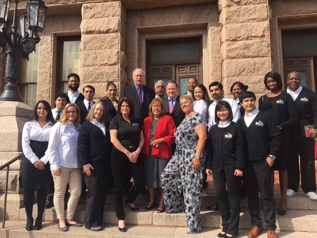 Board of Trustees Chair Eva Loredo, and trustees Adriana Tamez, Carolyn Evans-Shabazz, Robert Glaser and John Hansen pose with HCC staff and students on the steps of the Texas State Capitol on Community College Day on Feb 7. 
