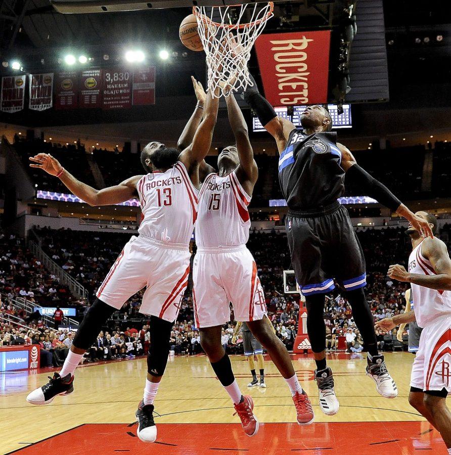 Houston Rockets guard James Harden (13), center Clint Capela (15) and Orlando Magic guard C.J. Watson (32) fight for a rebound in the second half of an NBA basketball game, Tuesday, Feb. 7, 2017, in Houston. Houston won the game 128-104. (AP Photo/Eric Christian Smith)
