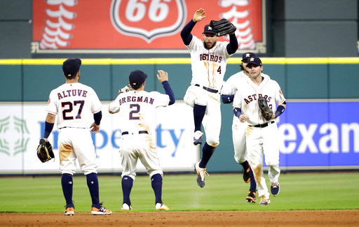 Houston Astros' George Springer (4) celebrates with Alex Bregman (2) after defeating the Los Angeles Angels 3-0. (AP Photo/David J. Phillip)