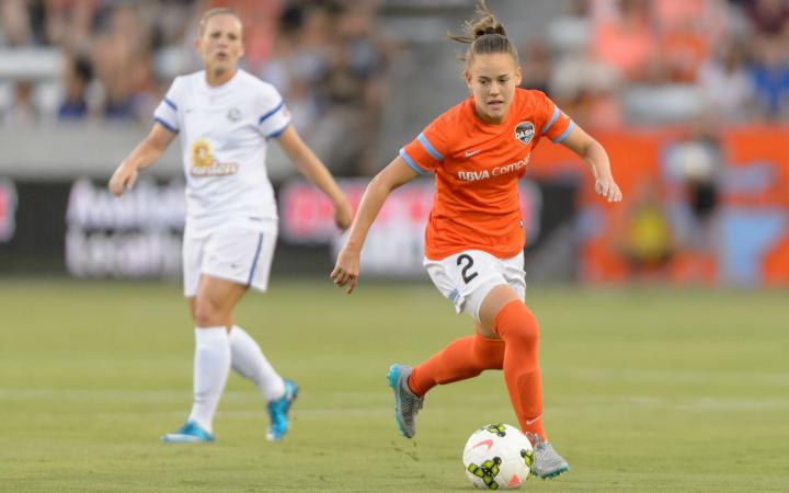 Houston Dash's Andressinha dribbles ball.