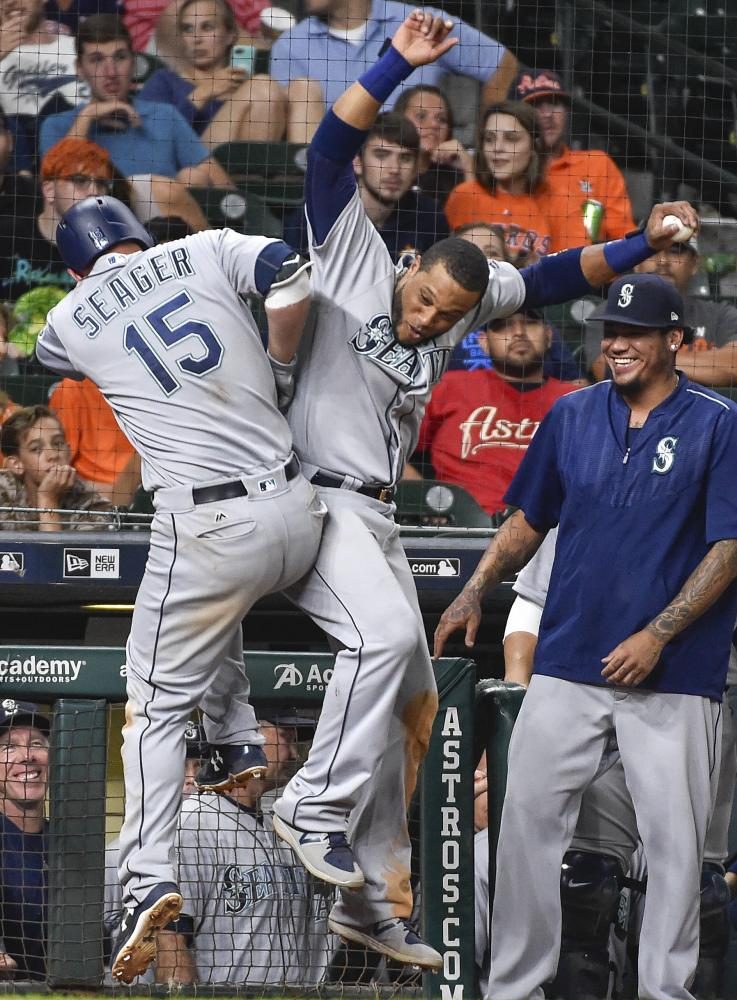 Seeger celebrates go ahead home run in the 10th inning.
(AP Photo/Eric Christian Smith)