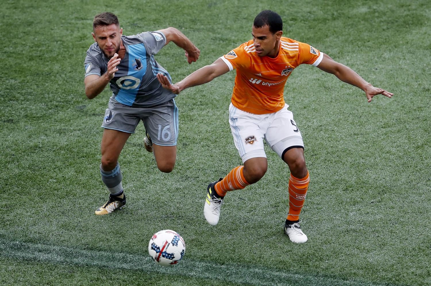 Minnesota United's Bashkim Kadrii (16) and Houston Dynamo's Juan Cabezas (5) vie for the ball. (Carlos Gonzalez/AP)