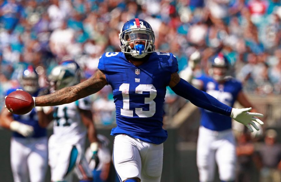 FILE - In this Oct. 7, 2018, file photo, New York Giants Odell Beckham Jr. celebrates a catch against the Carolina Panthers during the first half of an NFL football game in Charlotte, N.C. Two people familiar with the blockbuster trade say the Cleveland Browns have agreed to acquire Beckham from the Giants. (AP Photo/Jason E. Miczek, File)