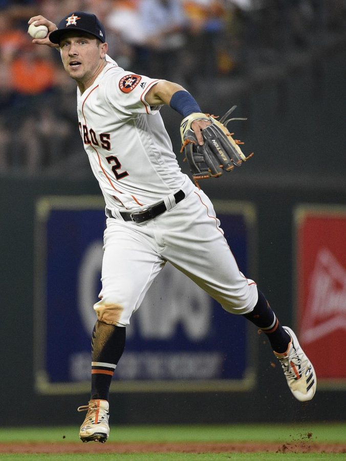 Houston Astros shortstop Alex Bregman throws out Milwaukee Brewers Lorenzo Cain during the third inning of a baseball game Wednesday, June 12, 2019, in Houston. (AP Photo/Eric Christian Smith) 