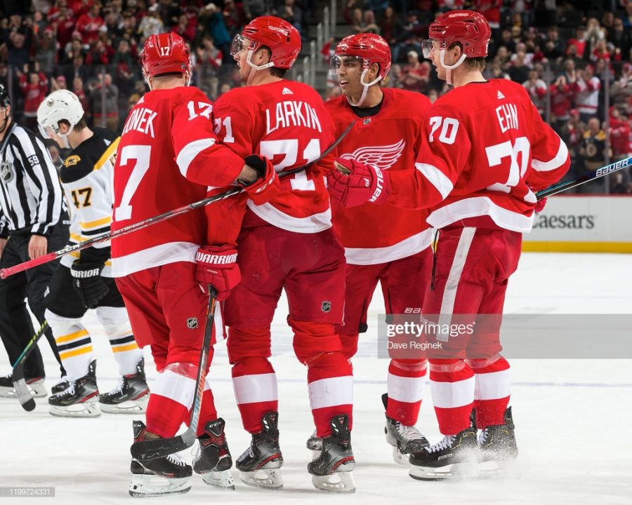 DETROIT, MI - FEBRUARY 09: Andreas Athanasiou #72 of the Detroit Red Wings celebrates his second goal of the third period goal with teammates Filip Hronek #17, Dylan Larkin #71 and Christoffer Ehn #70 during an NHL game against the Boston Bruins at Little Caesars Arena on February 9, 2020 in Detroit, Michigan. Detroit defeated Boston 3-1. (Photo by Dave Reginek/NHLI via Getty Images)