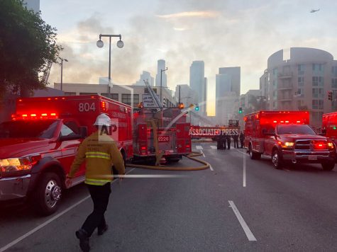 Firefighters respond to an explosion in downtown Los Angeles that has injured multiple firefighters and caused a fire that spread to several buildings, Saturday, May 16, 2020, in Los Angeles. (AP Photo/Stefanie Dazio)