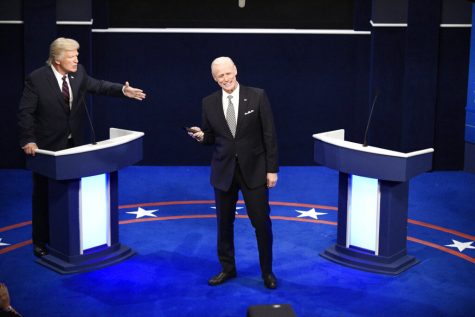 This image released by NBC shows Alec Baldwin as Donald Trump, left, and Jim Carrey as Joe Biden during the